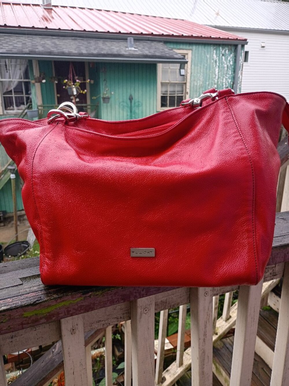 Red Pulicati leather hobo shoulder bag.